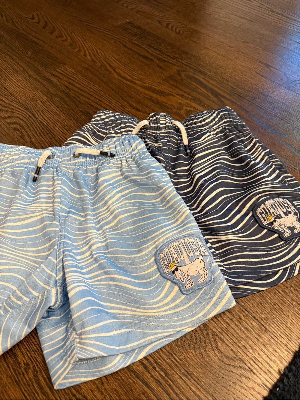 TWO pairs of Goat USA Boys' Navy White and light blue and white Striped Shorts